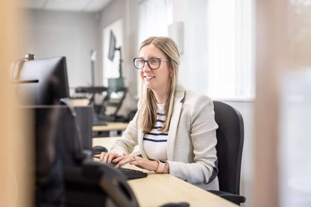 Photo of a person working on a computer